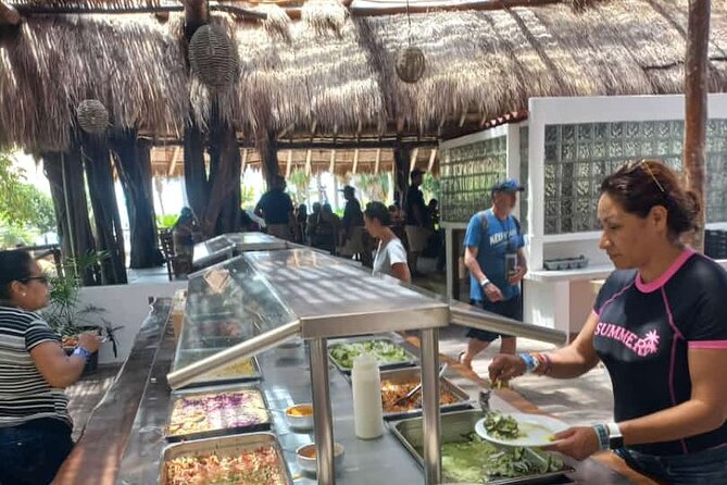 7hrs / 46ft Catamaran Private Charter From Cancun to Isla Mujeres - The beach club buffet lunch: good fuel, with a watch item