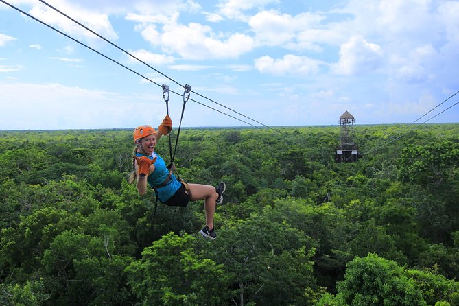 ATV Xtreme and Zipline Adventure from Riviera Maya - Ziplining: Harness Up, Fly Through the Canopy, Land by the Cenote