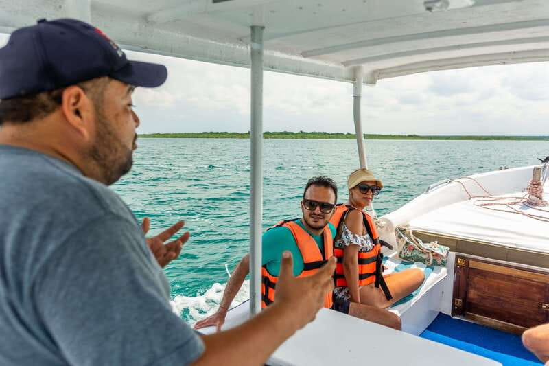 Bacalar: 3 Hour Boat Trip with Swimming & Drinks - Onboard drinks, fruit, and the guides who set the tone