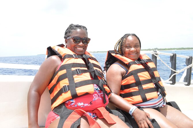 Best Parasailing Cozumel + Locker - Getting geared up on the boat, with safety kept up front