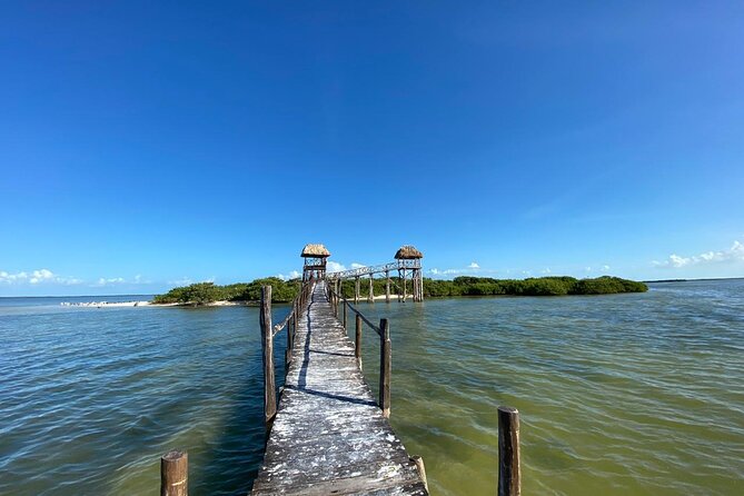 Boat Tour of Three Islands in Holbox with Transportation - Stop 1: Yalahau Lagoon and the Ojo de Agua freshwater pool