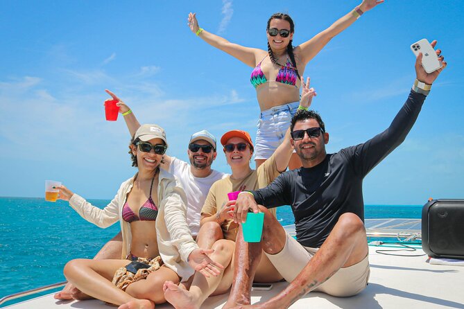 Cancun Catamaran: Isla Mujeres, Snorkeling, Drinks & Buffet Lunch - Drinks, Crew, and the Photo-Chasing Reality