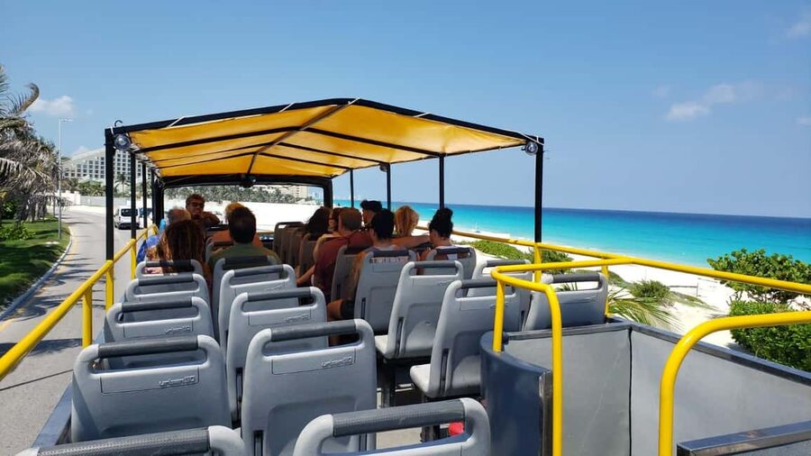 Cancun: Guided City Tour with Shopping by Double Decker Bus - Tequila Tasting at Plaza La Fiesta, plus Candy and Chocolate Time