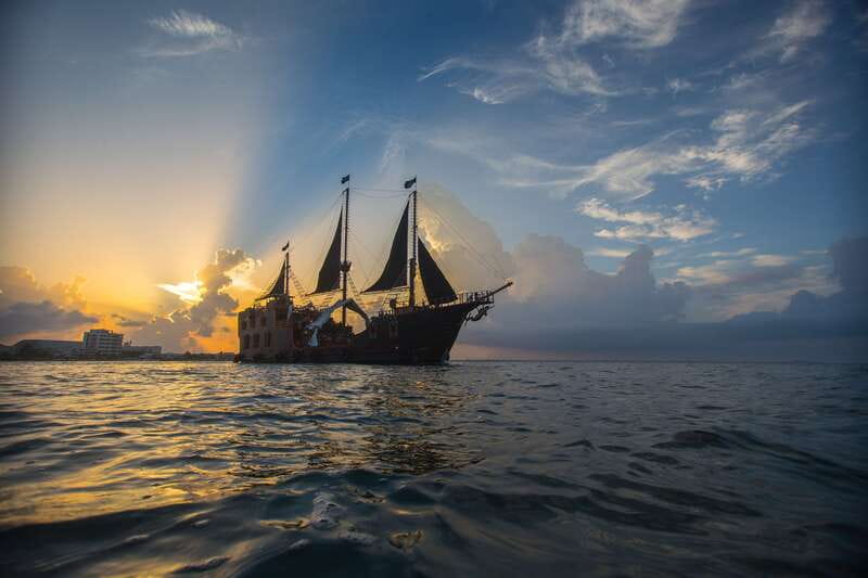 Cancún: Jolly Roger Pirate Dinner Cruise 2025 - A galleon at golden hour, with a full pirate storyline