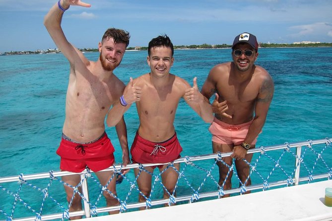 Catamaran Tour to Isla Mujeres all Included - Jumping from the catamaran and the beach club rhythm