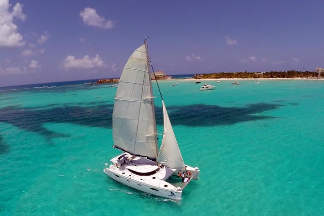 Catamaran Tour to Isla Mujeres, Open bar, Lunch, Snorkeling, Beach Club Included - Price, the $20 dock fee, and real value at $77
