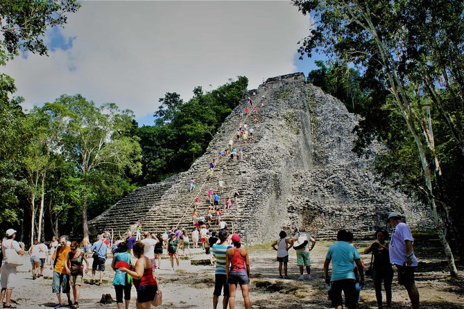 Coba and Tulum, cenote swim and buffet lunch - Stop 1: Tulum archaeological site, walls, sea views, and a guided Mayan story