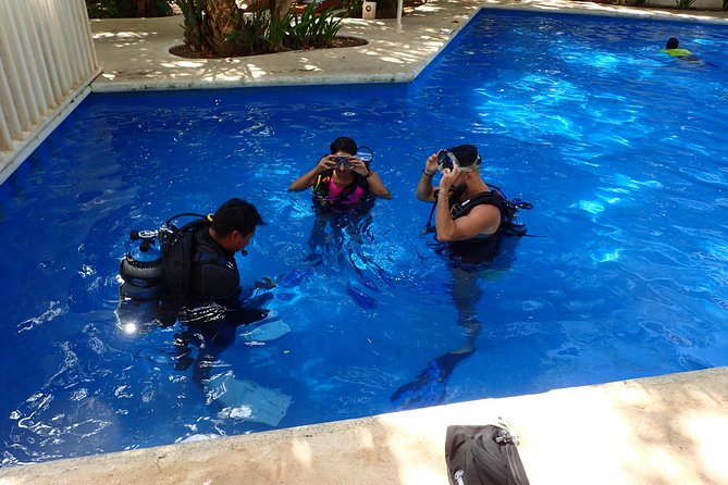 Diving in the Mexican Caribbean for Beginners | 2 Tanks 2 Dives | All Inclusive - Underwater Stop One: MUSA Sculptures at 33 ft / 10 m