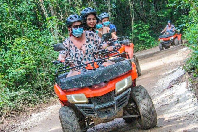 Drive an Atv shared, swim in a Cenote and ziplines in the Cancun - Cenote Swim: sacred water, quick time, and the optional jump
