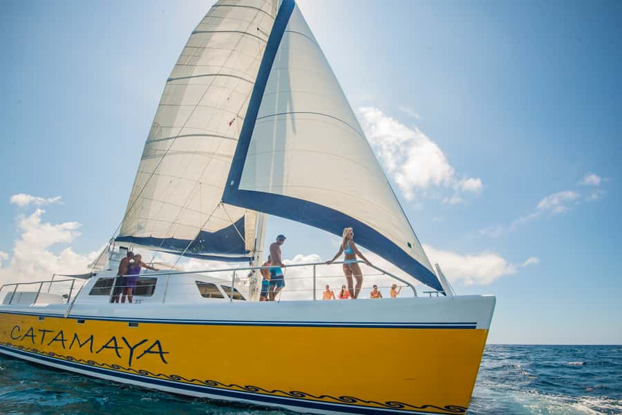 From Puerto Aventuras: Share Catamaran Tour - A 65-foot catamaran day that stays focused on the water
