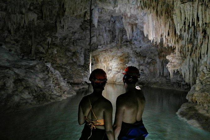 Hidden Cenote exploration in Playa del Carmen - A secret cenote tour that trades crowds for careful lighting