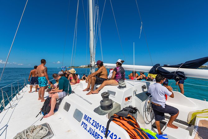 Isla Mujeres Catamaran, Open Bar & Optional Buffet and pick up - Marina Las Perlas check-in, pickup options, and the $20 dock tax moment