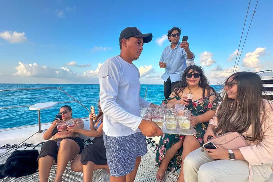 Isla Mujeres: Catamaran Ride with Open Bar, Snorkeling, and Lunch - On-board experience: drinks, crew energy, and the social factor