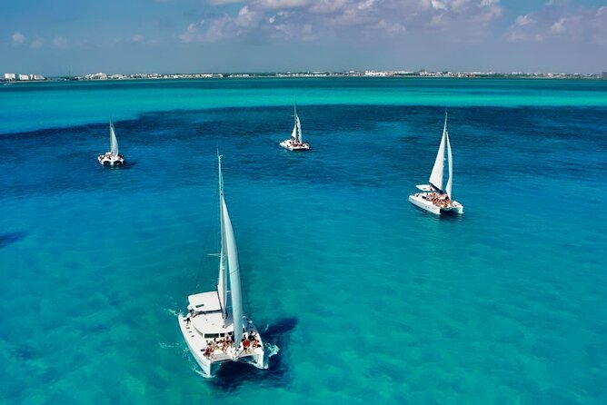 Isla Mujeres Catamaran Sailing Experience with Lunch & Open Bar - Beach club docking: where the lunch and open bar hit their best moment