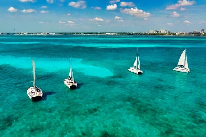Isla Mujeres Catamaran Sailing Experience with Lunch & Open Bar - The return trip at sunset: spinnaker sail odds and the mood shift home
