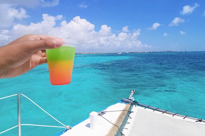 Isla Mujeres Premium Catamaran Tour with transportation from Playa del Carmen - Language and Group Size: What to Expect on Board