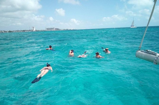Isla Mujeres Premium Catamaran Tour with transportation from Playa del Carmen - The Catamaran Ride: Open Bar, Music, and a Crew That Stays Busy
