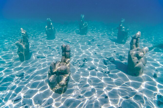 Top Isla Mujeres Catamaran Tour with Snorkel Open Bar and Buffet lunch - Price math: $37 looks great, but plan for the docking fee