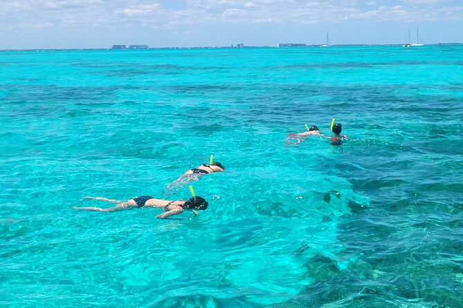 Tour to Cozumel by Catamaran with Snorkeling and Buffet Lunch - Playa Mía Grand Beach Park: lunch, beach time, and open-bar details