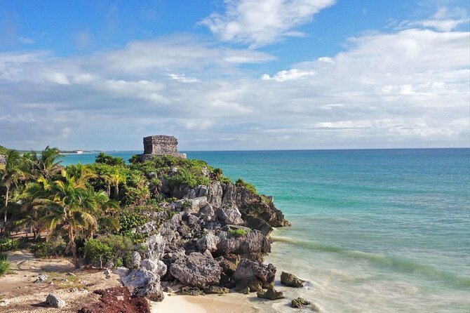 Tulum Ruins & Cenote guided private tour from Tulum and Riviera Maya. - Tulum Archaeological Site with a guide who explains the Mayan story
